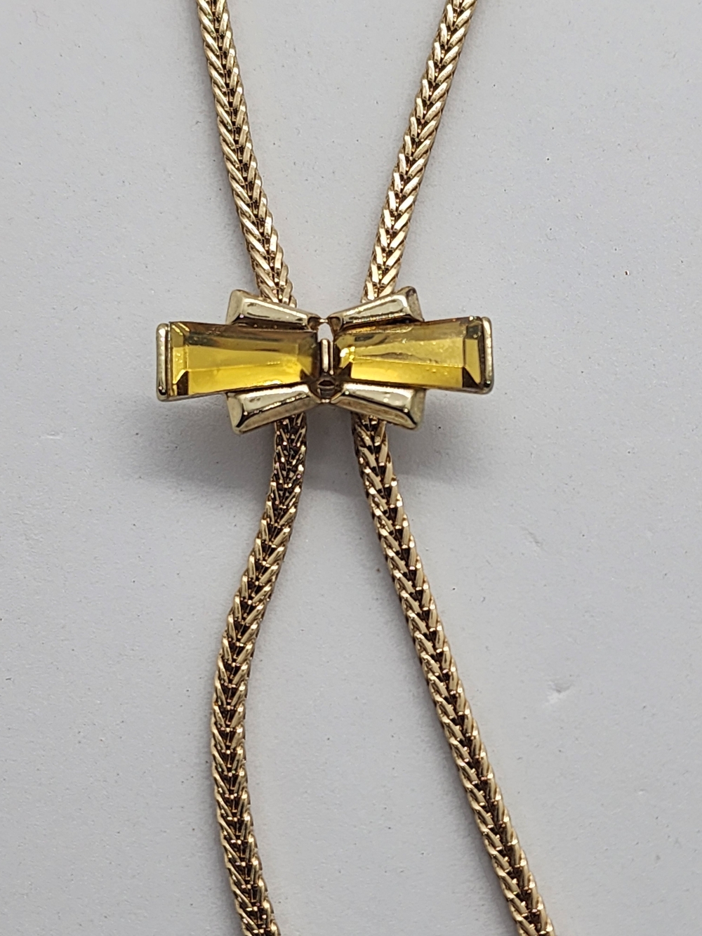 BCBGeneration Gold-Tone Bow Bolo Tie Necklace with Yellow Crystal
